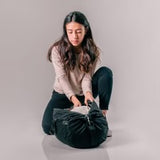 Matador Refraction packable duffle bag in compact, lightweight design, shown folded and partially expanded.