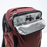 Matador GlobeRider35 travel backpack in garnet color with multiple compartments and adjustable straps, designed for versatile travel.