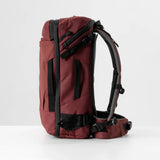 Matador GlobeRider35 travel backpack in garnet, showing its compact design and multiple compartments for organized travel.