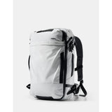 Matador GlobeRider35 travel backpack in white with multiple compartments and adjustable straps for outdoor adventures.
