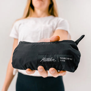Matador ReFraction™ packable waist pack with adjustable strap and compact design, ideal for outdoor and travel use.