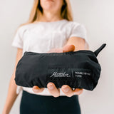 Matador ReFraction™ packable waist pack with adjustable strap and compact design, ideal for outdoor and travel use.