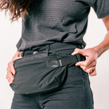 Matador ReFraction™ packable waist sling bag with adjustable strap and compact design, ideal for travel and outdoor activities.