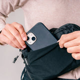 Matador ReFraction™ Packable Sling waist pack in black, shown folded and expanded, compact and lightweight for travel and outdoor use.