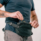 Matador ReFraction™ packable waist sling in compact design, featuring adjustable strap and multiple compartments for everyday carry.
