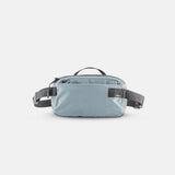 Matador ReFraction™ packable waist sling in blue, shown folded and partially extended, compact and lightweight travel accessory.
