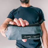 Matador ReFraction™ packable waist sling with adjustable strap and multiple compartments, designed for convenience and outdoor use.