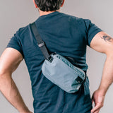 Matador ReFraction™ packable waist sling bag with adjustable strap and compact design, ideal for outdoor and everyday use.