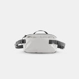 Matador ReFraction™ Packable Sling waist pack in white with gray accents, compact and lightweight for easy carrying.