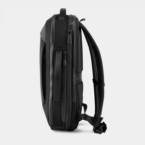 Black Nomatic Navigator Series 15L backpack with sleek design, side view showing durable material and compact storage features.