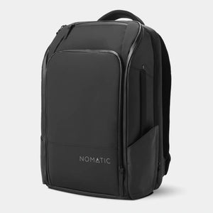 Black Nomatic Travel Pack 20L-30L with multiple compartments and adjustable straps, shown from a front angle.