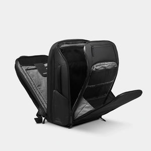 Black Nomatic Travel Pack 20L-30L with multiple compartments and ergonomic design, suitable for travel and organization.