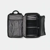 Black Nomatic Travel Pack 20L-30L with multiple compartments, padded shoulder straps, and sleek design for versatile travel use.