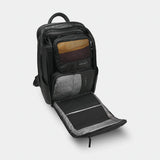 Black Nomatic Travel Pack 20L-30L with multiple compartments and padded straps, designed for organized travel and comfort.