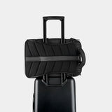 Black Nomatic Travel Pack 20L-30L with sleek design and multiple compartments, suitable for laptop and travel essentials.