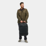 Black Nomatic Navigator Collapsible Duffel Bag 42L with sturdy handles and zipper closure, designed for versatile travel and storage.