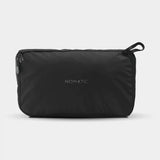 Black Nomatic Navigator Collapsible Duffel 42L with handles and zipper, shown folded and expanded for versatile travel storage.