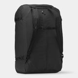 Black Nomatic Navigator collapsible duffel bag with 42L capacity, shown collapsed and expanded, featuring sturdy handles and durable material.