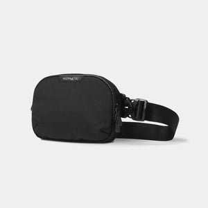 Black Nomatic Access Sling bag with adjustable strap and compact design, perfect for carrying essentials comfortably.
