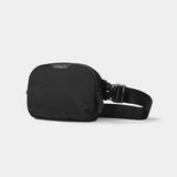 Black Nomatic Access Sling bag with adjustable strap and compact design, perfect for carrying essentials comfortably.