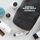 Small Nomatic toiletry kit with durable fabric, compact design, and organized compartments for travel toiletries.