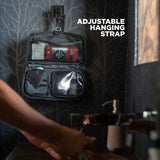 Small Nomatic toiletry bag with hanging hook, compact design, organized compartments, ideal for travel toiletry kit storage.