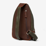 Osgoode Marley Cyrus sling bag in moss green with adjustable strap and front zipper pocket, stylish and functional accessory.
