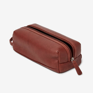 Small leather travel kit from Osgoode Marley, a compact toiletry bag with a sleek leather exterior and organized interior.