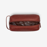 Small leather Osgoode Marley toiletry bag with zipper closure, compact travel kit for toiletries and grooming essentials.