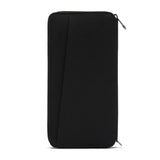 Black Pacsafe RFIDsafe RFID blocking travel wallet with multiple card slots and secure zipper closure.