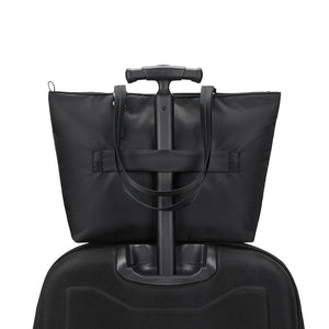 Large Pacsafe anti-theft carryall tote bag with secure zippers and padded handles, designed for stylish everyday use.