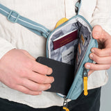 Pacsafe Go Anti-Theft Tech Crossbody bag in black with adjustable strap and security features visible.
