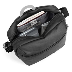 Pacsafe GO anti-theft festival crossbody bag in jet black with secure zipper and adjustable strap, designed for outdoor use.