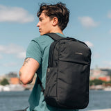 Pacsafe anti-theft 20L city backpack in black with multiple compartments and secure zippers, designed for urban travel and daily use