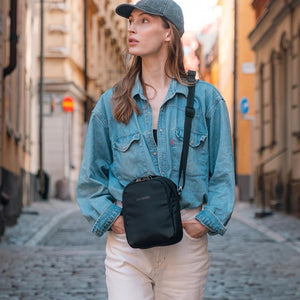 Pacsafe V Anti-theft Companion Crossbody bag with secure zippers and adjustable strap, designed for everyday use.