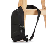 Black Pacsafe V Anti-Theft Action Sling Pack with secure compartments, designed for comfortable, safe carrying of essentials.
