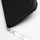 Black Pacsafe RFIDsafe™ RFID blocking travel wallet with multiple compartments for secure organizing of travel documents and cards.