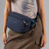 Pacsafe V Anti-Theft Hip Pack waist bag with multiple compartments and secure zippers, designed for travel and everyday use.