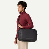 Patagonia Black Hole Micro MLC 22L backpack with compact black design, durable material, and multiple compartments for versatile storage.