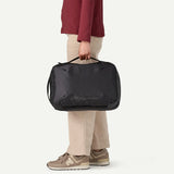 Patagonia Black Hole Micro MLC 22L backpack in black, showing its compact design and durable material for travel and daily use.