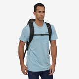 Patagonia Black Hole Pack 25L backpack in black with adjustable straps and durable fabric, designed for outdoor and daily use.