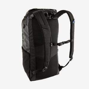 Patagonia Black Hole Pack 25L backpack with black durable fabric, adjustable straps, and zippered compartments for outdoor use.