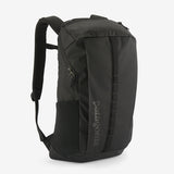 Patagonia Black Hole Pack 25L backpack with black durable fabric and adjustable straps, ideal for travel and outdoor use.