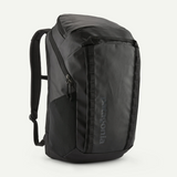 Patagonia Black Hole Pack 32L backpack featuring durable black fabric and adjustable shoulder straps for outdoor use.
