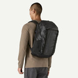 Patagonia Black Hole Pack 32L backpack with adjustable shoulder straps, durable black fabric, and top handle for carrying.