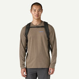 Patagonia Black Hole Pack 32L backpack with adjustable shoulder straps and front zip pocket, black color, large capacity.