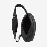 Open Patagonia Ultralight Black Hole® Sling 8L backpack showing black water-resistant fabric and adjustable strap.