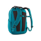 Patagonia Atom Tote Pack 20L backpack with black and blue color, featuring durable straps and spacious main compartment.