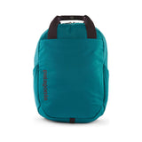 Patagonia Atom Tote Pack 20L backpack with black and blue fabric, featuring adjustable straps and a spacious main compartment.