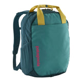 Patagonia Atom Tote Pack 20L backpack with black fabric, top handle, and adjustable shoulder straps on a plain background.